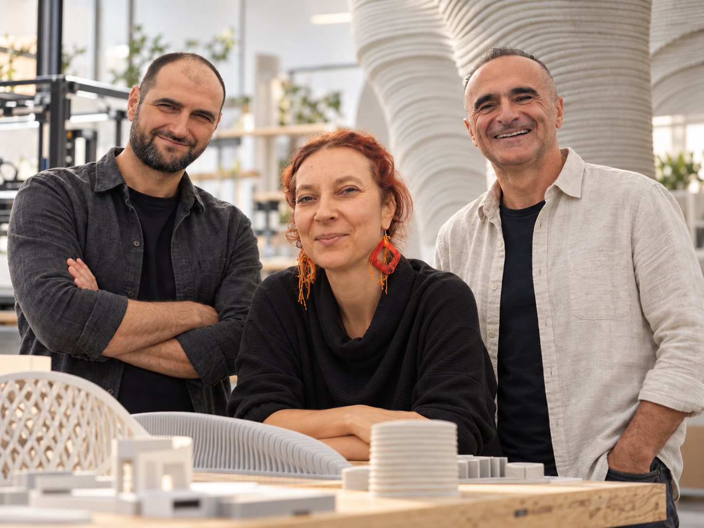The three founders of AUTOM8 in a studio with 3D-printed models