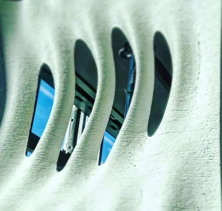 Curved structure with openings